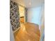 Light and airy entryway with wood floors and modern wallpaper at 150 E Robinson St # 1411, Orlando, FL 32801