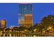 Luxury high-rise building with city and lake views at dusk at 150 E Robinson St # 1411, Orlando, FL 32801