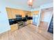 Modern kitchen with stainless steel appliances and wood cabinets at 150 E Robinson St # 1411, Orlando, FL 32801