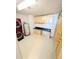 Laundry room with washer, dryer, cabinets, and additional storage at 150 E Robinson St # 1411, Orlando, FL 32801