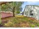 Landscaped backyard with a brick wall for privacy at 15336 Firelight Dr, Winter Garden, FL 34787