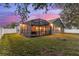 Lovely home with screened patio, lush lawn, and firepit at 15336 Firelight Dr, Winter Garden, FL 34787