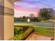 Charming backyard view with pond and fountain at sunset at 15336 Firelight Dr, Winter Garden, FL 34787