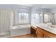 Bathroom with a bathtub, shower, and modern vanity at 15336 Firelight Dr, Winter Garden, FL 34787