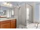 Bathroom features a shower and soaking tub with wood cabinets at 15336 Firelight Dr, Winter Garden, FL 34787