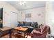 Cozy bedroom with wood floors, a sofa, and a closet at 15336 Firelight Dr, Winter Garden, FL 34787