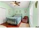 Bedroom with hardwood floors and ceiling fan at 15336 Firelight Dr, Winter Garden, FL 34787