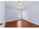 Spacious bedroom with wood flooring and a double door closet at 15336 Firelight Dr, Winter Garden, FL 34787