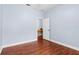 Bedroom with hardwood floors and access to an office at 15336 Firelight Dr, Winter Garden, FL 34787