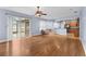 Open dining room with hardwood floors, view of kitchen and access to backyard at 15336 Firelight Dr, Winter Garden, FL 34787