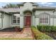 Brick walkway leads to a red front door at 15336 Firelight Dr, Winter Garden, FL 34787