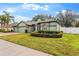 Charming single-story home with a lush green lawn and well-manicured landscaping at 15336 Firelight Dr, Winter Garden, FL 34787