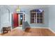 Bright foyer featuring wood floors, an arched entry, and a red front door at 15336 Firelight Dr, Winter Garden, FL 34787