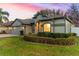 Charming house exterior with manicured landscaping and two-car garage at 15336 Firelight Dr, Winter Garden, FL 34787