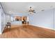 Open concept living room with kitchen and hardwood floors at 15336 Firelight Dr, Winter Garden, FL 34787