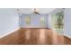 Spacious living room with hardwood floors and large windows at 15336 Firelight Dr, Winter Garden, FL 34787