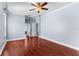 Spacious main bedroom with wood floors, crown molding, and an ensuite bathroom entrance at 15336 Firelight Dr, Winter Garden, FL 34787