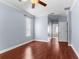 Bright main bedroom with wood floors, crown molding, and natural light at 15336 Firelight Dr, Winter Garden, FL 34787