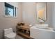 Elegant powder room featuring a vessel sink and a gold framed mirror at 16106 Pendio Dr, Bella Collina, FL 34756