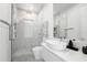 Clean bathroom with modern fixtures and a large, frameless shower at 16106 Pendio Dr, Bella Collina, FL 34756