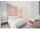 Spacious bedroom with a large bed, stylish decor, and plenty of natural light at 16106 Pendio Dr, Bella Collina, FL 34756