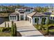 Luxury two-story home with a front yard at 16106 Pendio Dr, Bella Collina, FL 34756