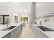 Modern kitchen with stainless steel appliances and a large island at 16106 Pendio Dr, Bella Collina, FL 34756