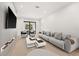 Spacious living area with comfortable seating and a large TV at 16106 Pendio Dr, Bella Collina, FL 34756