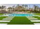Inviting rectangular pool with spacious surrounding patio and lush landscaping at 16106 Pendio Dr, Bella Collina, FL 34756