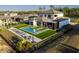 Modern home with a large pool and patio at 16106 Pendio Dr, Bella Collina, FL 34756