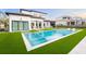 Resort-style pool and patio with modern home at 16106 Pendio Dr, Bella Collina, FL 34756