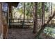 Lovely wooden deck in a forest setting, perfect for relaxing and enjoying the wooded views at 221 Se 125Th Terrace Rd, Silver Springs, FL 34488