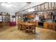 Open kitchen and dining room layout with wood cabinets and an adjacent dining table at 221 Se 125Th Terrace Rd, Silver Springs, FL 34488