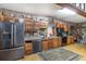 Functional kitchen featuring wood cabinets and a patterned rug at 221 Se 125Th Terrace Rd, Silver Springs, FL 34488