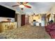 Spacious main bedroom featuring a ceiling fan, a desk area, a dresser, and a large TV at 221 Se 125Th Terrace Rd, Silver Springs, FL 34488
