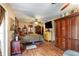 Comfortable main bedroom with wood floors and ample storage space at 221 Se 125Th Terrace Rd, Silver Springs, FL 34488