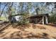 Spacious outbuilding with open bays, ideal for storage or workshop, set in a wooded area at 221 Se 125Th Terrace Rd, Silver Springs, FL 34488