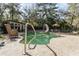 Backyard swimming pool with a slide, patio furniture, and lush landscaping at 221 Se 125Th Terrace Rd, Silver Springs, FL 34488