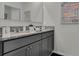 Double vanity bathroom with granite countertops at 2974 Salisbury Ave, Haines City, FL 33844