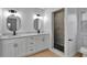 Modern bathroom with double vanity, walk-in shower, and stylish fixtures at 326 Morning Creek Cir, Apopka, FL 32712