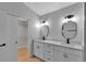 Elegant bathroom featuring double sinks, a large closet, and updated finishes at 326 Morning Creek Cir, Apopka, FL 32712