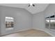 Spacious bedroom with light grey walls and laminate wood floors at 326 Morning Creek Cir, Apopka, FL 32712