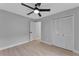 Well-lit bedroom with double doors leading to closet and ceiling fan at 326 Morning Creek Cir, Apopka, FL 32712