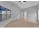 Bright bedroom with ceiling fan and access to bathroom at 326 Morning Creek Cir, Apopka, FL 32712