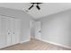 Spacious bedroom with double doors leading to closet and ceiling fan at 326 Morning Creek Cir, Apopka, FL 32712
