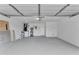 Spacious and clean garage with ample storage space and a well-lit interior at 326 Morning Creek Cir, Apopka, FL 32712