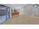 Bright open floor plan features sleek hardwood floors and sliding glass doors to the patio at 326 Morning Creek Cir, Apopka, FL 32712