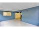 Enclosed patio area with blue walls and access to the interior of the home at 326 Morning Creek Cir, Apopka, FL 32712