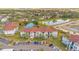 Aerial view of apartment buildings, parking, and a pond at 3714 Palm Desert Ln # 5317, Orlando, FL 32839