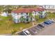 Apartment building near a pond with parking in front at 3714 Palm Desert Ln # 5317, Orlando, FL 32839